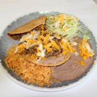 Taco & Tostada · Includes rice and beans.