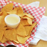 Chips & Queso · CHIPS WITH CREAMY CHEESE SAUCE.