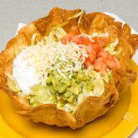 Taco Salad · Served with beans,lettuce, tomatoes,cheese,sour cream and guacamole with your choice of meat.
