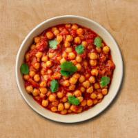 Charismatic Chickpea · Chickpea is cooked with different spices and herbs and veggies. Served with a side of rice.