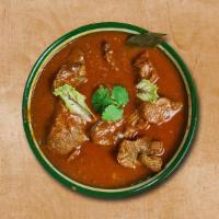 Lamb Legendary · Tender lamb pieces really spiced up with the indian spices and heated upon the clay pot. Ser...
