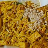 Pad Thai Curry · Thin rice noodles sautéed in a yellow curry sauce with bean sprouts and green onions, topped...
