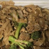 Pad See Ew · Thick rice noodles with broccoli.