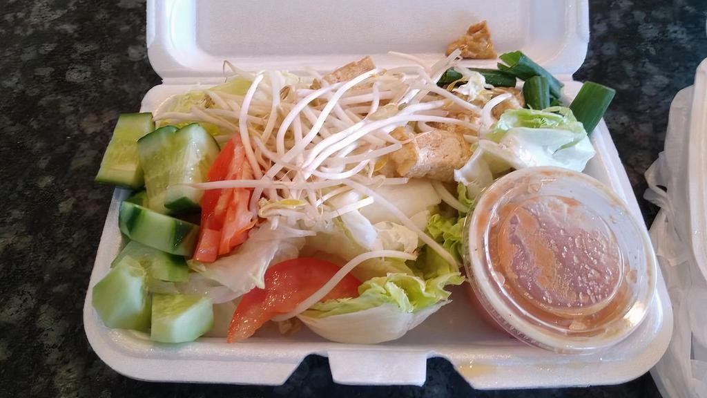 Thai Salad · Lettuce, cucumber, tomato, bean sprouts, and onions with a side of peanut sauce.