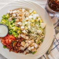 Cobb Salad · Mixed greens, grilled chicken breast, tomatoes, blue cheese crumbles, bacon, avocado, and a ...