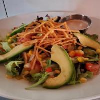 Coyote Salad · Romaine lettuce, pico de gallo, corn relish, black beans, avocado, crispy tortilla strips, q...