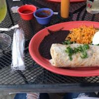 Oaxaca Burrito · sautéed onions, bell pepper, tomatoes elote, and cilantro with melted cheese inside a large ...