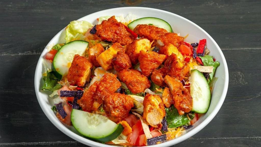 Buffalo Chicken · Favorite. House salad with chopped fried chicken tenders tossed in your favorite sauce.