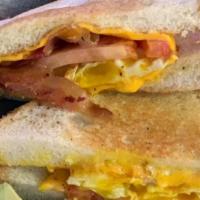 Clutch Club · Layers of ham, bacon, and turkey with juicy tomatoes, crisp lettuce, and Cheddar cheese crea...