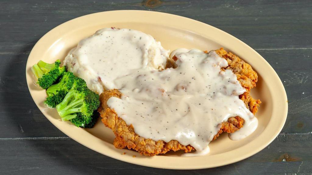 Country Fried Steak · Favorite. Tender steak, lightly breaded and golden fried. Smothered with country milk gravy served mashed potatoes.