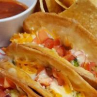 Tostada Tacos · Favorite. Three tostada tacos topped with beans, cheese and your choice of beef or chicken. ...
