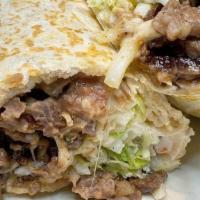 Burrito · Choice of meat, lettuce, tomato, cheese, sour cream, and beans. Add Chimichanga, Suiza for a...
