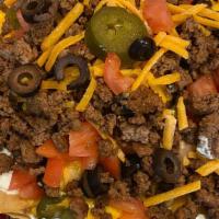 Loaded Nachos · BP Classic nachos are a dozen corn tortillas, cut, fried and generously topped with seasoned...