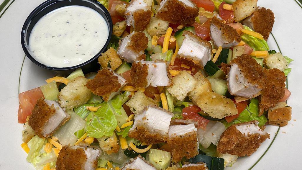 Chicken Salad · BP Chicken Salad is your choice of juicy grilled chicken breast or crispy fried chicken breast sliced on top of bed of crispy romaine lettuce, tomato wedges, cucumber slices, shredded cheddar cheese, sliced hard boil egg, and our homemade croutons served with your choice of dressing.
