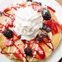 Berry Good :Pancakes · Berry mascarpone, blackberry coulis, vanilla crème anglaise, fresh berries and whipped cream.