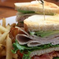 Beach Club · Roasted turkey, applewood smoked bacon, lettuce, tomato, avocado, white Cheddar cheese and m...