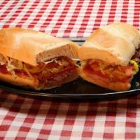 Italian Sub · Deli sliced ham, salami, jumbo pepperoni, Provolone cheese, lettuce, Roma tomatoes, hot pepp...
