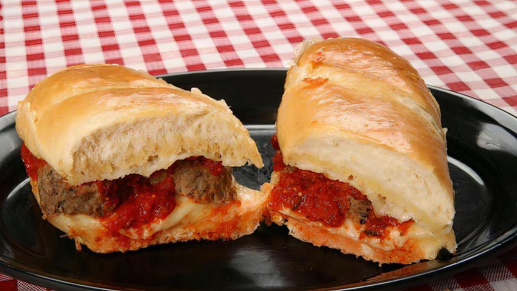 Meatball Sub · Topped with garlic butter, Provolone cheese, Italian meatballs and our signature sauce.