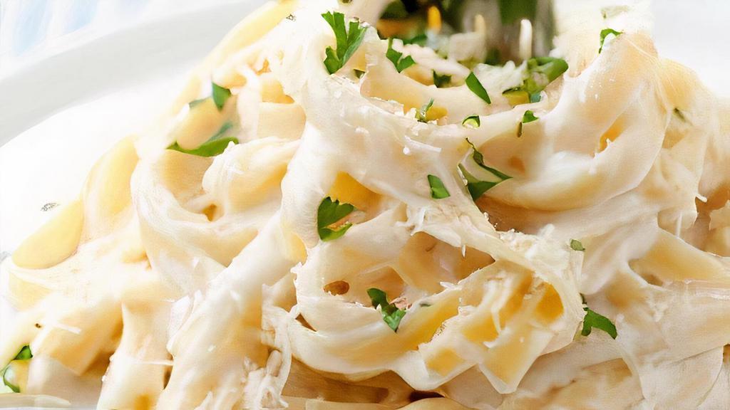 Fettuccine Alfredo (Side) · A generous portion of fettuccine topped with our
creamy alfredo sauce.