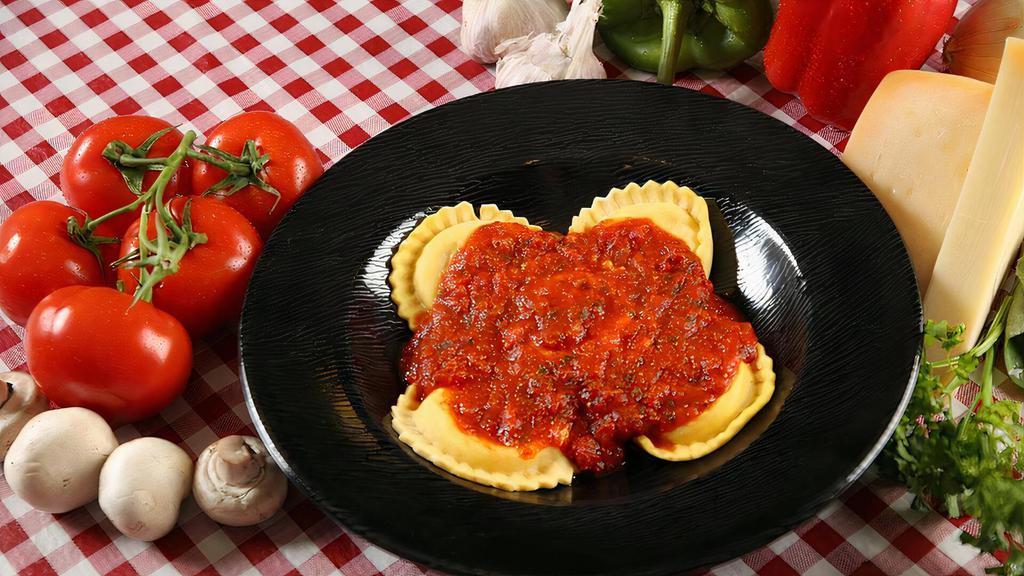Ravioli (Dinner) · A generous portion of cheese stuffed raviolis topped with your choice of our signature sauce or meat sauce. Served with a side of garlic bread and a small garden salad.