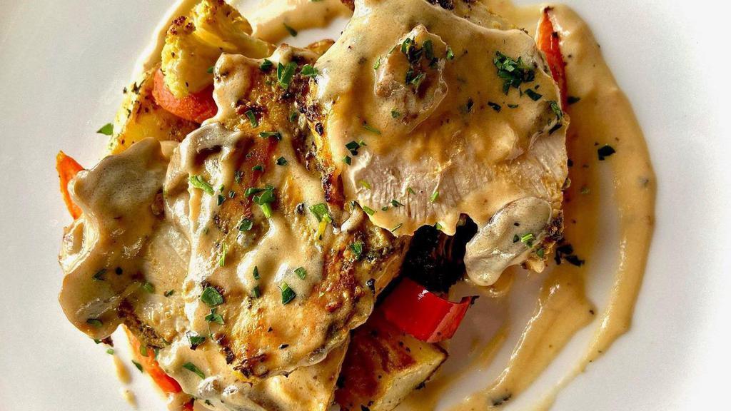 Chicken Marsala · Grilled Chicken topped with a creamy mushroom Marsala sauce, served with Herb Roasted Potatoes, Sautéed Spinach