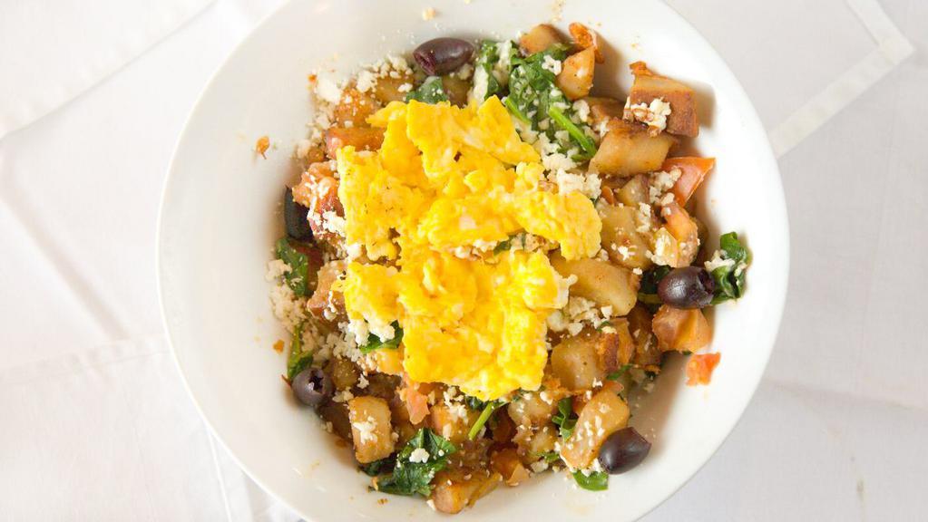 Greek Bowl · Grilled Tomatoes and spinach, Greek olives, and feta cheese over country potatoes with your choice of two eggs and side of toast.