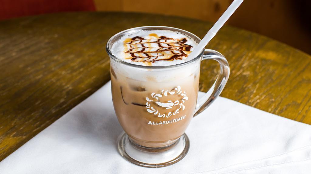 Iced Caramel Macchiato · An iced combination of freshly pulled espresso, vanilla syrup, caramel syrup, milk, and ice. Topped with milk foam and drizzle.
