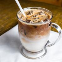 Iced Café Latte · An iced combination of freshly pulled espresso, milk, and ice.