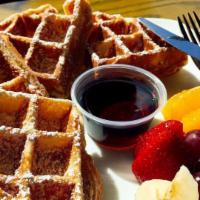 Breakfast Waffle · Homemade fresh Belgian style waffle. Comes with a side of maple syrup and fresh fruits. (Ban...