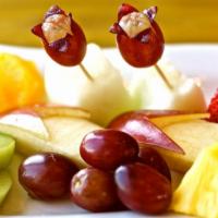 Fresh Fruit Plate · An assortment of fresh fruits. Fruits: apple, kiwi, banana, strawberry, grapes, orange, melo...