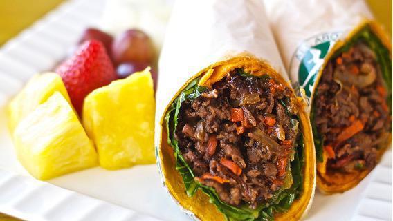 Bulgogi Wrap · Freshly made and house marinated Korean bulgogi beef. Sautéed with yellow onions and carrots. Wrapped in a jalapeño cheddar tortilla wrap with romaine. Comes with a side of chips or fresh fruit. (Pineapple, melon, and grapes).