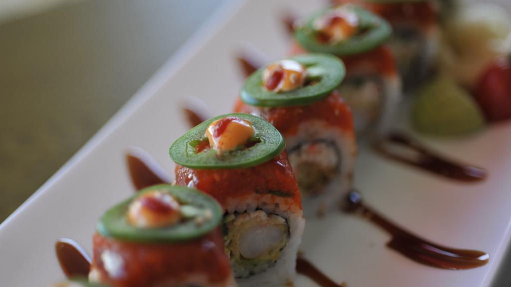 All About Fire Roll · All about Cha's original sushi roll.
A california roll with tempura shrimp inside.
Topped with spicy tuna, jalapeño slices, and sesame seed.
Sauce:eel sauce, spicy mayo, and sriracha 
Comes with a cup of miso soup.