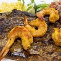 Steak & Shrimp · Grilled steak strips, four jumbo shrimp, mixed peppers & onions.