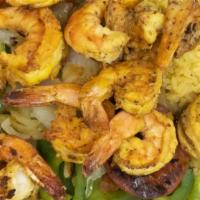 Camaron A La Plancha · Aet grilled jumbo shrimp with mixed peppers, tomatoes & onions.