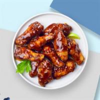 Bbq Bass Wings  · Fresh chicken wings breaded, fried until golden brown, and tossed in barbecue sauce. Served ...