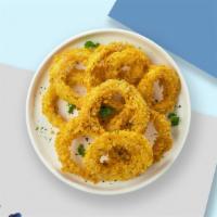 Over The Onion Rings  · (Vegetarian) Sliced onions dipped in a light batter and fried until crispy and golden brown.
