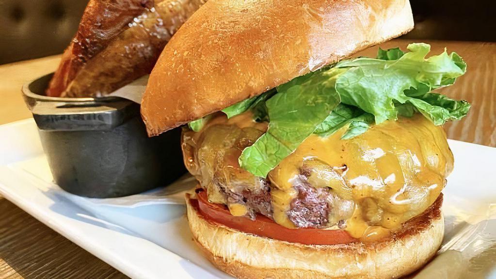 The Ohio Burger · house-ground grass-fed Ohio beef, Tillamook cheddar, lettuce &tomato, house aioli, TWH signature fries