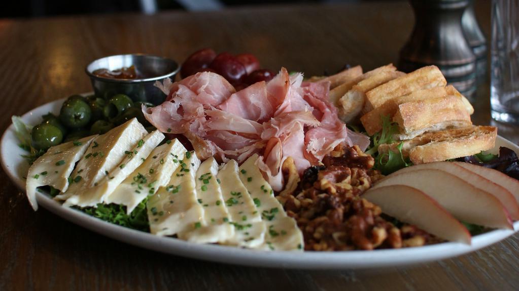 Charcuterie & Brie · shaved prosciutto, double cream brie, ripe pears, olives, toasted walnuts