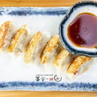 6 Pieces Gyoza · Pan fried pork with veggie stuffing with house special sauce.