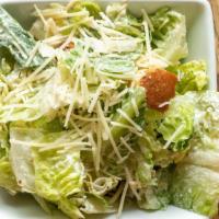 Small Caesar · Romaine Tossed in our Homemade Caesar Dressing with Grated Parmesan and Croutons.
