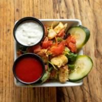 House Salad · A Mix of Iceberg lettuce and Spring Mix topped with Shredded Carrots, Tomato, Croutons, Shre...