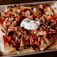 Pulled Pork Nachos · Tortilla Chips and Smoked Pulled Pork Covered with Shredded Cheese, White Queso, Pico De Gal...