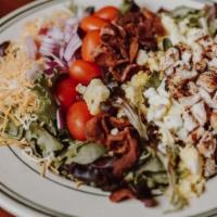 Cobb Salad · Mixed Greens, Crumbled Bacon, Red Onion, Diced Chicken, Hard Boiled Egg, Tomatoes, Shredded ...