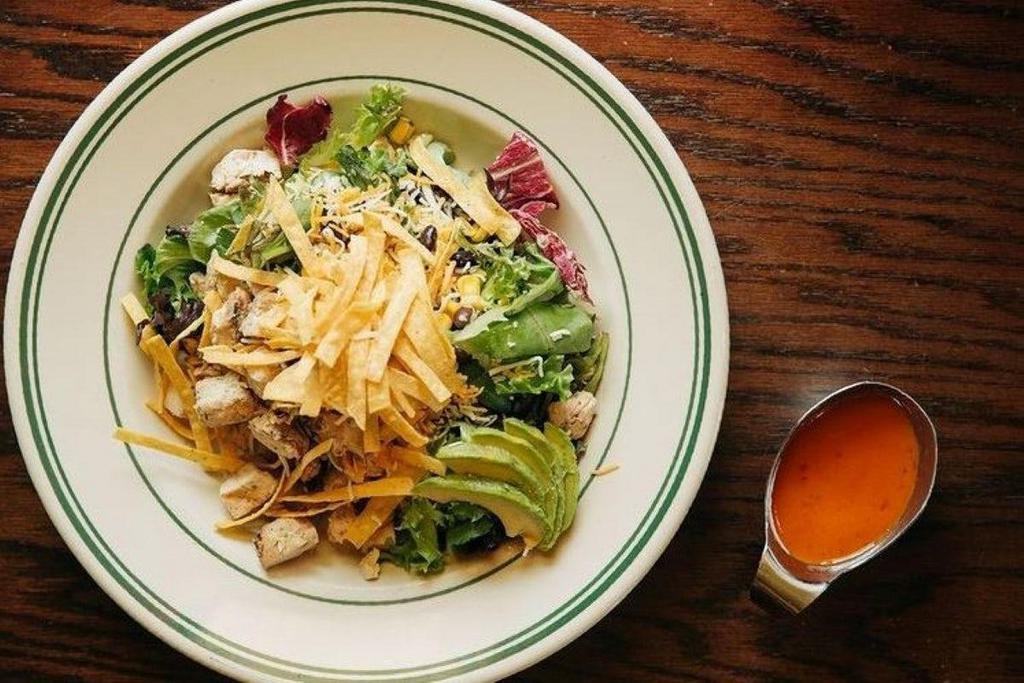 South City Salad · Mixed Greens, Roasted Corn, Black Beans, Avocado, Shredded Cheddar Jack, Tortilla Strips, and Diced Chicken with Avocado Ranch Dressing