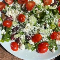 Greek Salad · Romaine, Artichokes, Feta, Tomato, Red Onion, Kalamata Olives, Cucumbers, Greek Dressing