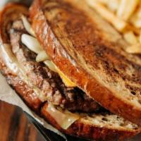 Patty Melt · ½ Pound Patty, Grilled Onions, with Big Eye Swiss and American Cheese, served on Marbled Rye