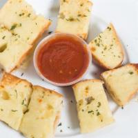 Cheese Bread · French bread buttered, covered with fresh sliced mozzarella cheese and baked. Served with re...