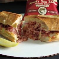 Canadian Bacon & Cheese · French bread covered with chopped Canadian bacon and mozzarella cheese, served hot with sea ...