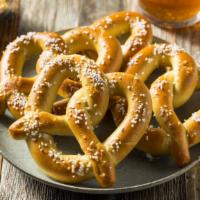 Bavarian Pretzel · Two soft Bavarian pretzels sprinkled with salt and served with warm Beer Cheese sauce.