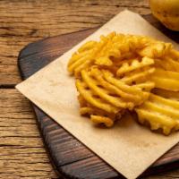 Seasoned Waffle Fries · Perfectly prepared fried waffle fries, served with a sprinkling of salt.